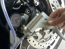 Bled the brakes after installing the cables using a Midyvac pump shown here (Harbor Freight).  I followed this video: Motorcycle Brake Repair: Replacing, Bleeding fluid by smallengineshop.