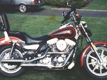 1985 Low Glide FXRS. My very first FXR....Love at first sight. Rode home in the pouring-ass rain. Leathers weighed about 50 pounds when I got home and I had a grin that didn't come off for a week 8^)