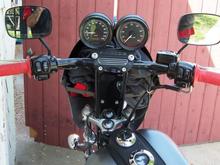 See my fatass in the mirror? My closet behind the fairing. Basic necessities Bottle of water, a hat, and a sweatshirt.