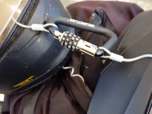 It came w the wire cable but im thinking its to thin so maybe ill upgrade it. Ill put my neck cover over the carabiner and cable like a sleeve so it doesnt attract to much attention.