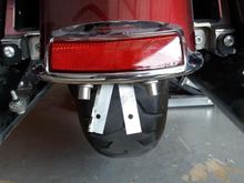 The 2 aluminum pieces swinging freely.