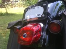 I had to relocate the turn signals So I made a curved bar with a hand forge and a file. I powder coated it black.