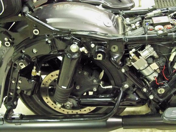 compressor, air tank on rear fender strut , bleed solenoid next to compressor...