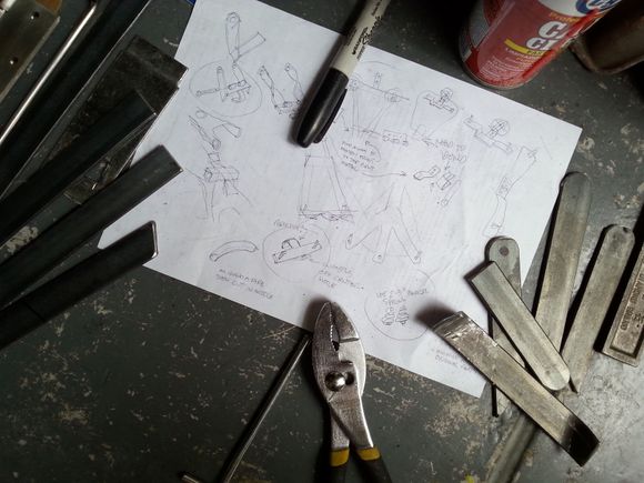 Started with some rough sketches... My design had to be, removable, no drilling in the frame, stable, not adding more height to the seat...