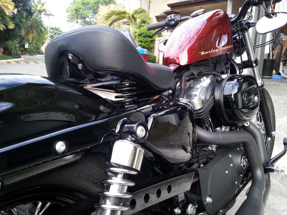 Finished seat spring project mounted in the bike. Seeing the "butt" now exposed, I had to cover it up somehow. Thought of putting a 3rd brake lite in it.