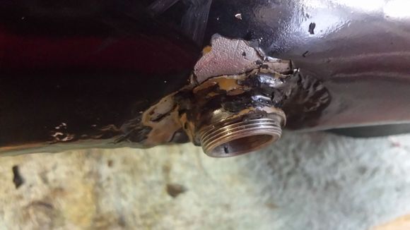 Used tank at local V-Twin parts store didn't last long. Sprung a leak. When i investigated it, this is what i found. A 'J-B' weld patch attempt on a leaking fitting. Now i know why i got such a good deal on it.