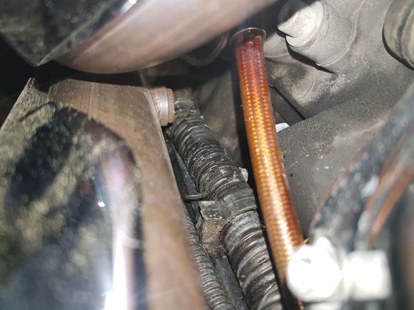 Oil is leaking out from between metal crimp end piece and braided/ coated cable.