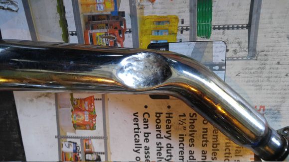 Had to dimple - dent is probably more accurate, the front pipe to clear the throw-out lever.