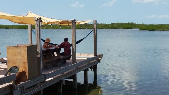 View of the lagoon and the dock adjacent to the pool area.