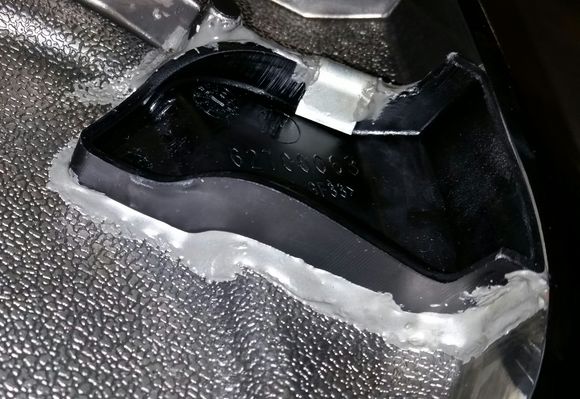 The JB Weld I used instead of the expensive MoCo adhesive is holding up very well. No signs of cracking or breakdown at all. 