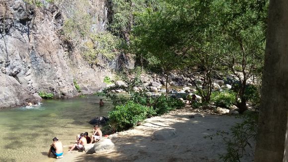 On the edge of a stream and mile high cliff.
