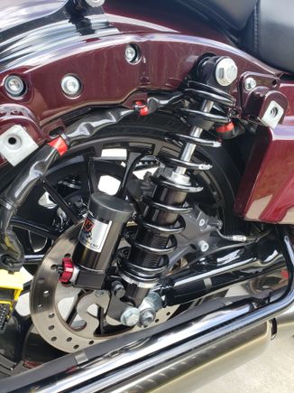 Not sure about the stockers but the RWD's I just put on had to be mounted upside down on touring bikes for bag clearance, seemed weird to me but I called RWD and they confirmed upside down was correct and has zero impact what so ever on performance.