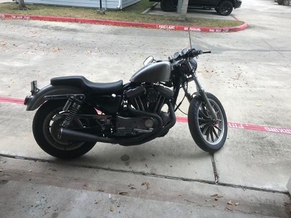 The tank and fender is bare metal with some clear coat.