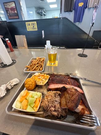3 meat plate with fries, fruit and Mac and cheese.