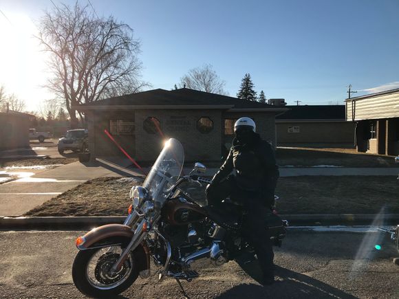 Dentist office. Wife on bike 😎. Lol. It has been freezing temps all week but today was above freezing. Round trip was a 100km. Almost forgot on the way home.  Started to cool off fast   