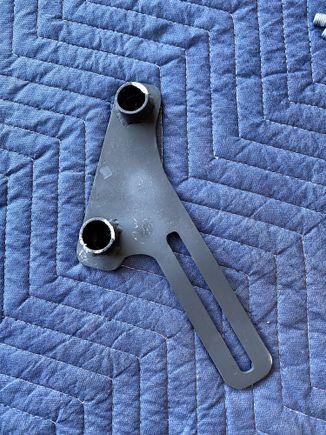 Bracket was painted flat black (still reeks of aerosol spray paint) then while the paint was wet it was wrapped in tissue paper and thrown in the bottom of the box for shipping. 