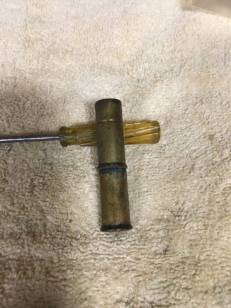So, any of y'all old-timers recognize this? It's a home-made bullet luber. There is a nail between the two shells that runs through the primer holes. A flat piece the diameter of the bullet is silver soldered to the end of the nail inside the top shell. Bullet wax is melted into a container and bullets placed into the wax. When the wax solidifies this tool is pushed down over a bullet, the bottom shell is pulled apart from the top which creates a vacuum and pulls the bullet from the wax.