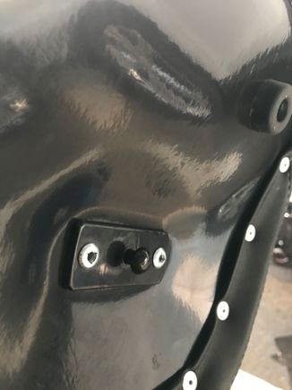 Pin at rear of seat