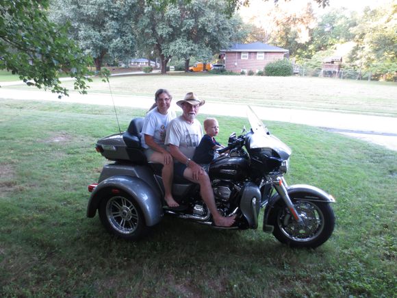 Grandson, wife and I on the new Trike.  Never thought this old "patched up" rider would be on such a civilian ride but we love it.