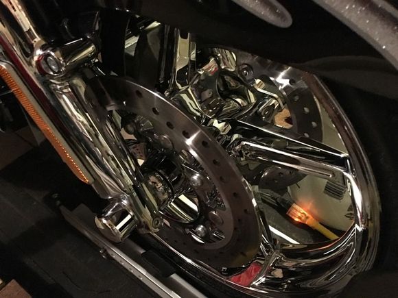 I think this is made by condor, it has the HD labels.  I got this at a swap meet, in the box for 150.

The make servicing, cleaning much easier and keeping the bike upright reduces the room needed in the garage.
