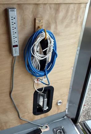 Cord and rope storage, vent, pass-through, passenger rear by door.