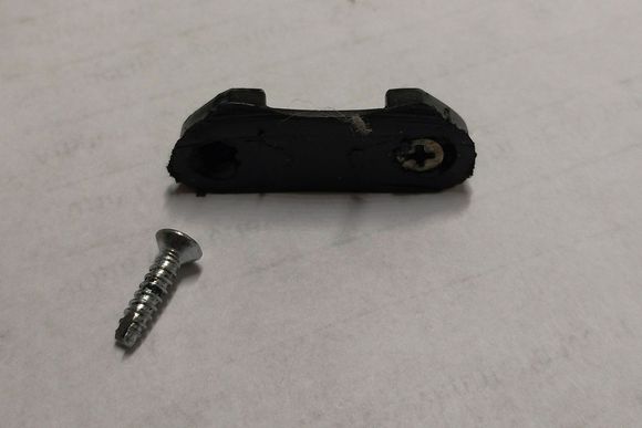 Old "alternator plug retainer" and the "good" screw. Note rubbing on retainer. Screw on the right is broken.