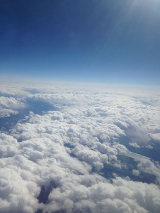 Flying high above the clouds --Sadly had to leave and return back to the dreary weather of the Northeast