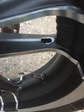I was just cleaning brake dust off my wheels and came across this hole in the rim. It looks like shit and doesn't look like a factory hole. I have 2 on the front rim and about 4 on the rear. Is it a drain hole? I just noticed it tonight on my 2017 Road Glide Special. I've had her 2 weeks. Any thoughts?
