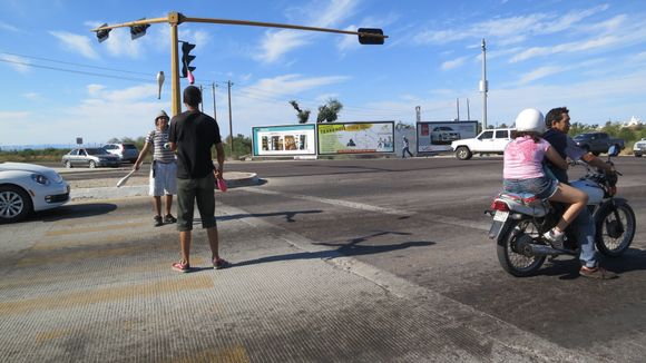 Street jugglers and a local couple on a bike, I think this is La Paz