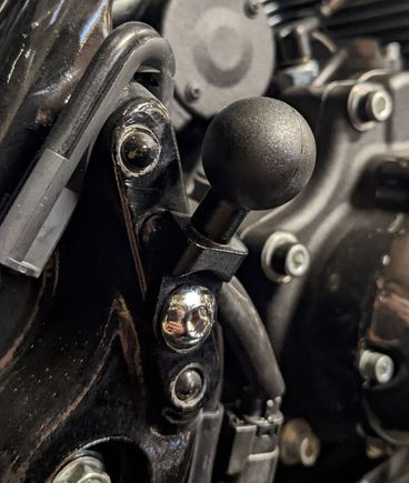 Here's a generic 1" ball with a 3/8 hole, perfect for mounting on the passenger peg (which I don't run)