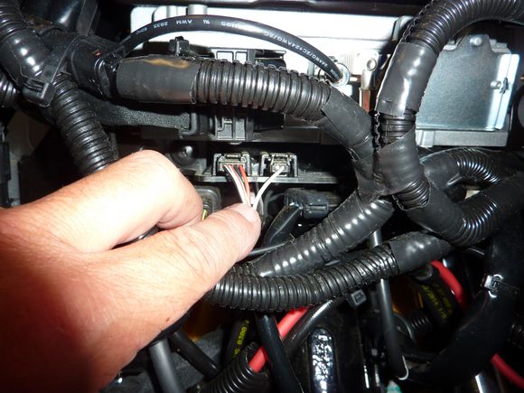 unplug the throttle side switch and TBW sensor wires from the "plug caddy" under the radio.  looking straight at the back of the radio the throttle wires are on the left and the clutch side switch wires are on the right.