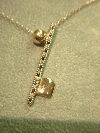 Saphire and diamond music note pendant in 14k white gold