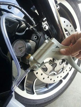 Bled the brakes after installing the cables using a Midyvac pump shown here (Harbor Freight).  I followed this video: Motorcycle Brake Repair: Replacing, Bleeding fluid by smallengineshop.