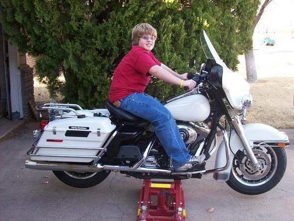This is my first pic of this bike (with my son Allan) the day I brought it home. The only thing I've added are rear footboards. More changes are coming.