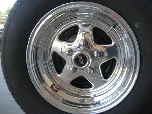 Weld racing prostars...rears are 15x8 4.5 backspacing with 255 60's, fronts are 15x7 4.5 backspacing with 225 60's.