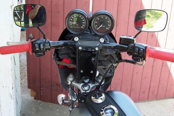 See my fatass in the mirror? My closet behind the fairing. Basic necessities Bottle of water, a hat, and a sweatshirt.