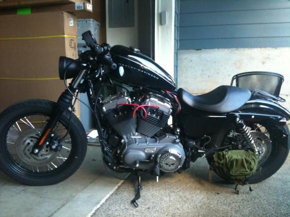 Coil/ignition relocated, drag bars, custom headlight, black heat shields and A/C