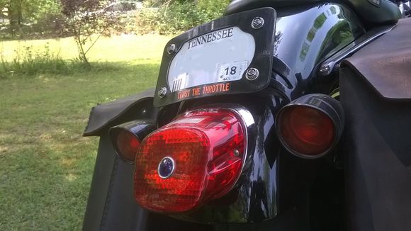 I had to relocate the turn signals So I made a curved bar with a hand forge and a file. I powder coated it black.