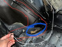 Water has been getting into my trunk so I ran water over the entire car and removed the trunk lining etc and noticed water dripping from the area I circled in blue.. the white is showing where it plugs into and the red shows where it runs to.. it’s runs up in the car but if anyone know what part this is please help