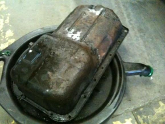 Changing the oil pan!!! As you can see this was rusted to shit.  HAD to do it TWICE!!!  LOL, yup, leaked after the first try.