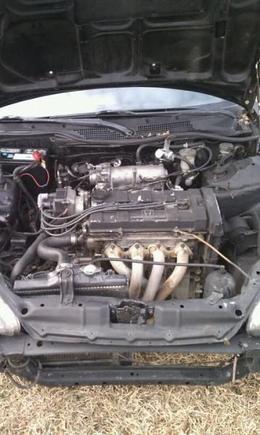 i know i know, looks like shit lol, has a ghetto regulator, dc headers, msd ignition. have a turbo kit to go on it after taxes come back and i rebuild the motor and tweak it a bit.