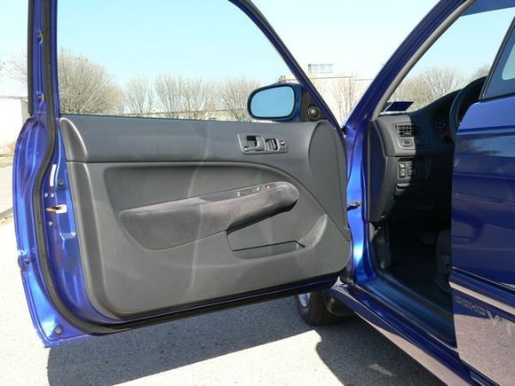 Driver side door.  Light reflections are making the whitish marks on door panel.