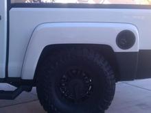 The T with the 35's stuffed into the wheel well. Try that with a stock jeep.