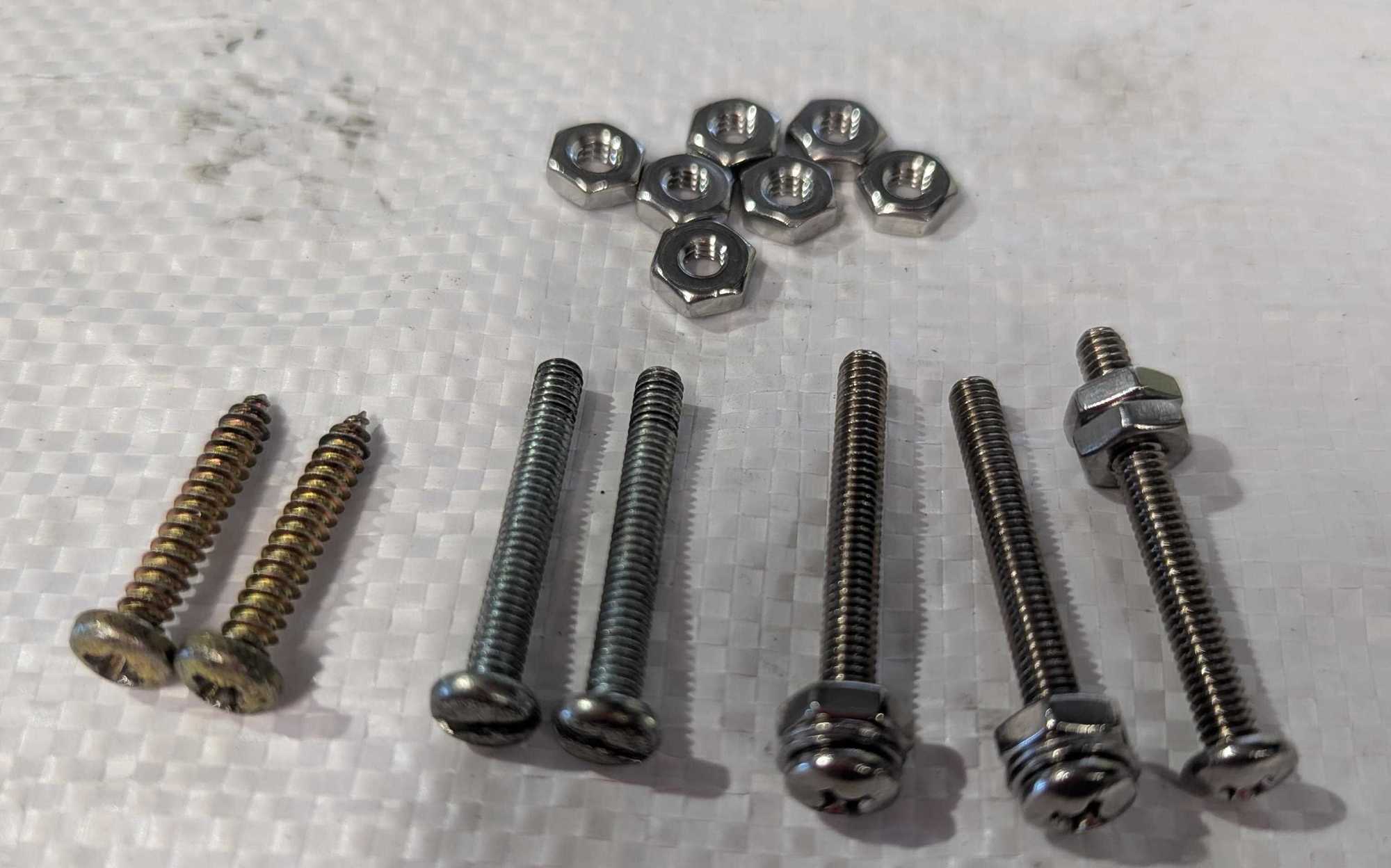 ST screws for horn push on left. Then 2 Jag screws, then better version. On right the shoulder screw.