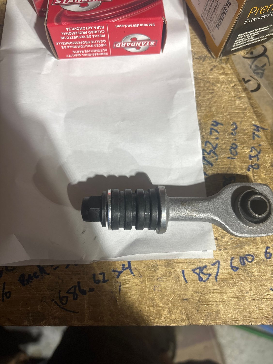 One of my new Dorman brand replacement rear sway bar end links, if you look closely, the middle groove in the rubber bushing is of slightly smaller diameter, which I believe is supposed to be pressed into the control arm mount thus leaving equal portions of rubber bushing both above and below mount, as opposed to using a two piece setup. 