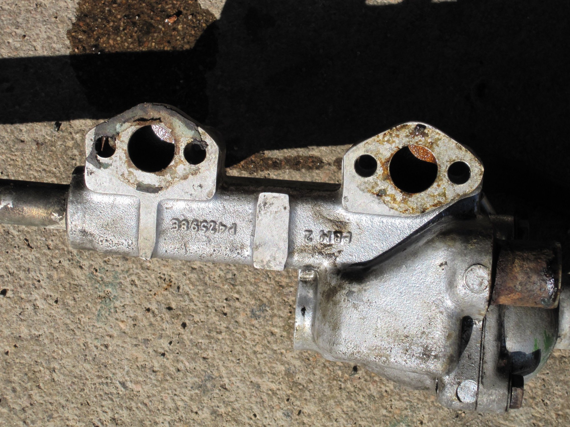Before mod OEM sizd holes from the block into the water manifold, through which coolant returns to the radiator