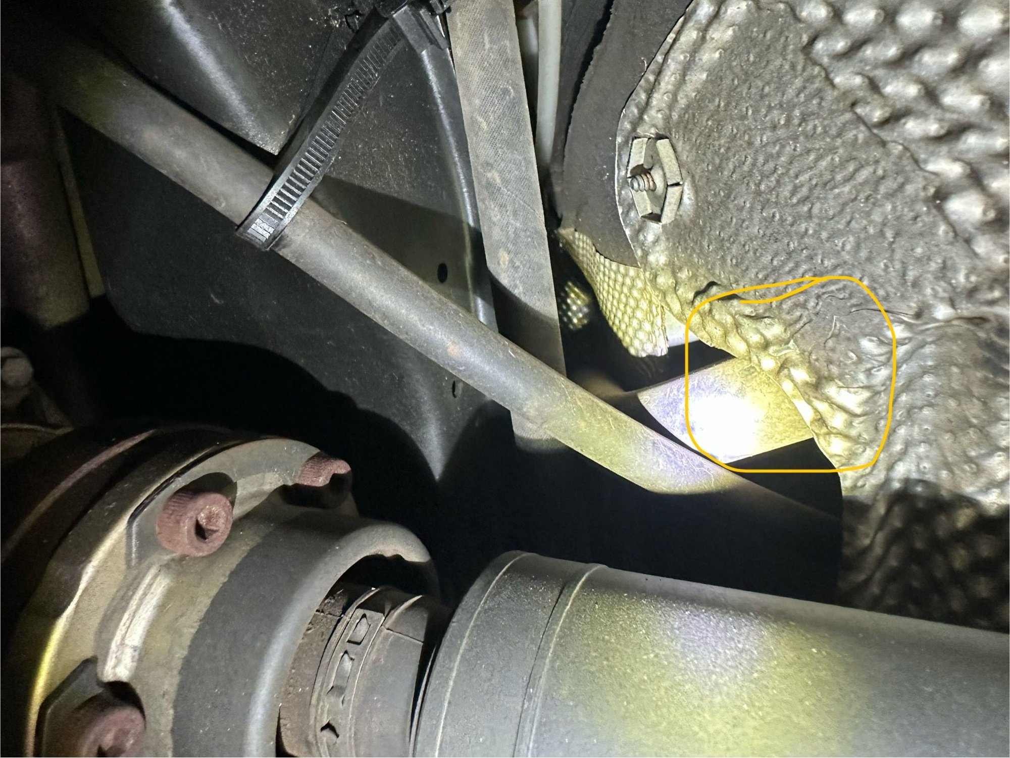 Heres where it was tucked behind the tunnel heat shield 