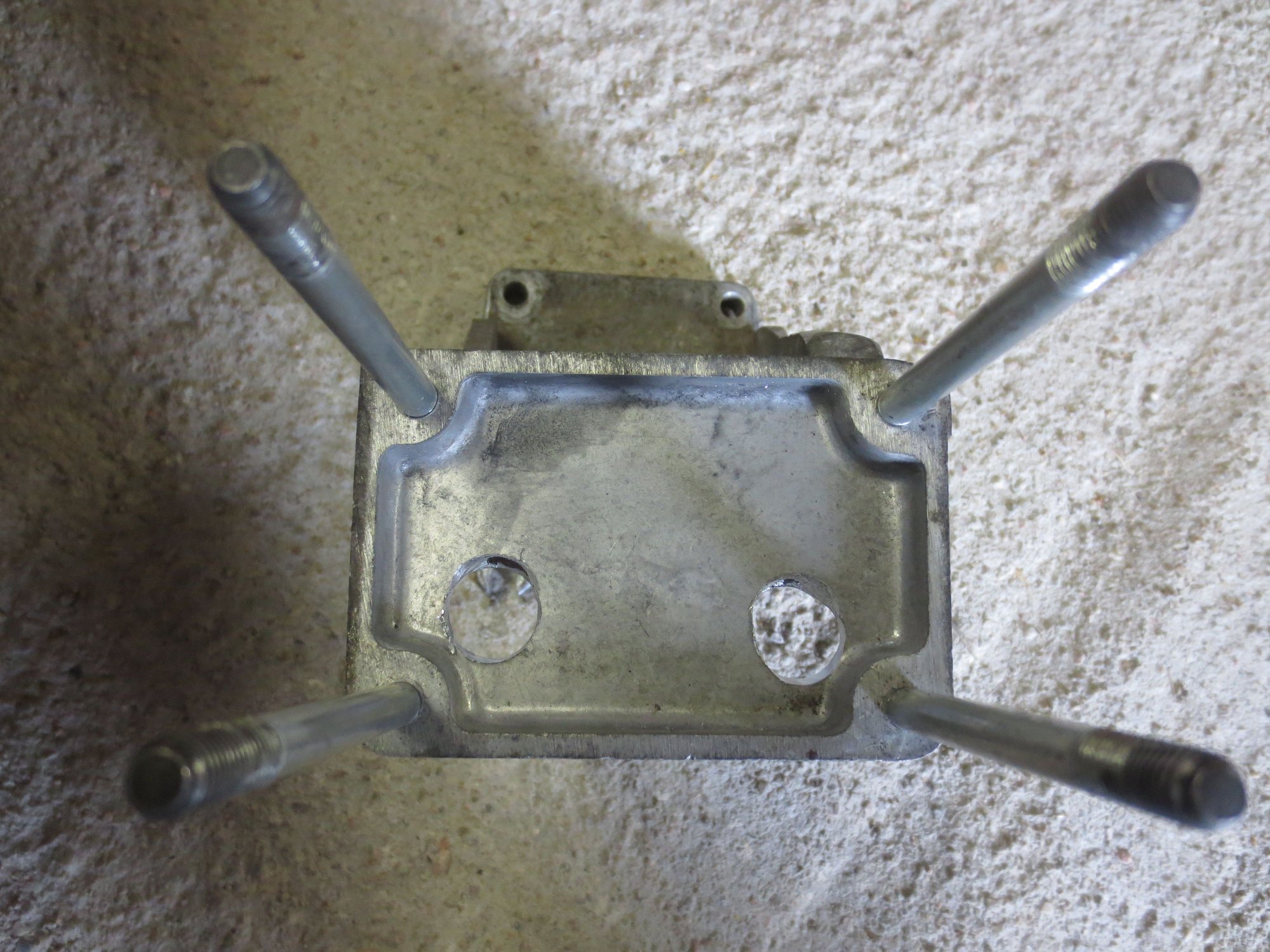 Access holes for rearmost slotted bolt holes