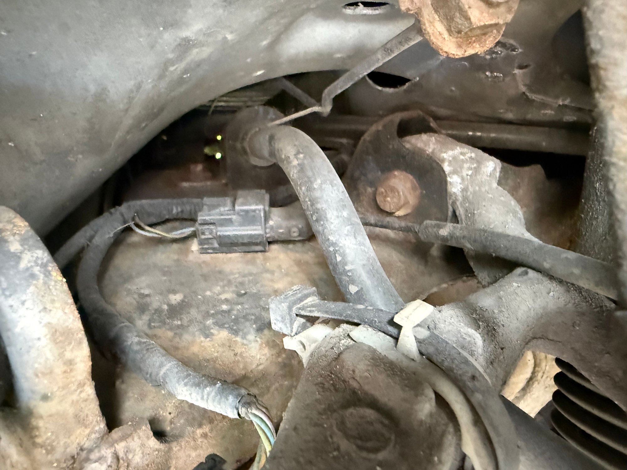 Left side - only has the one electrical connector for the wheel sensor 