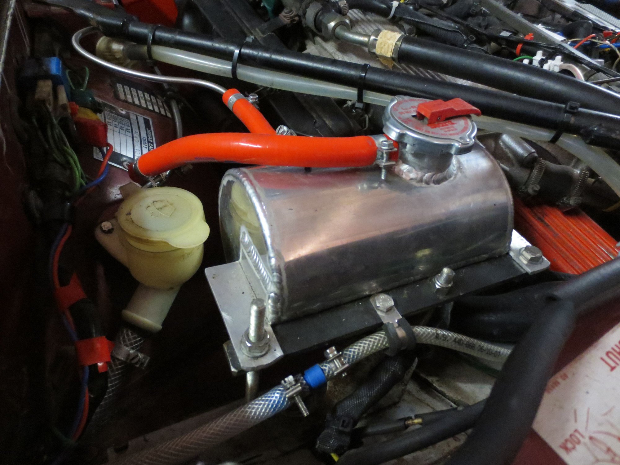 View from the rear looking forward. Filler for ming mounted washer bottle by the tank.